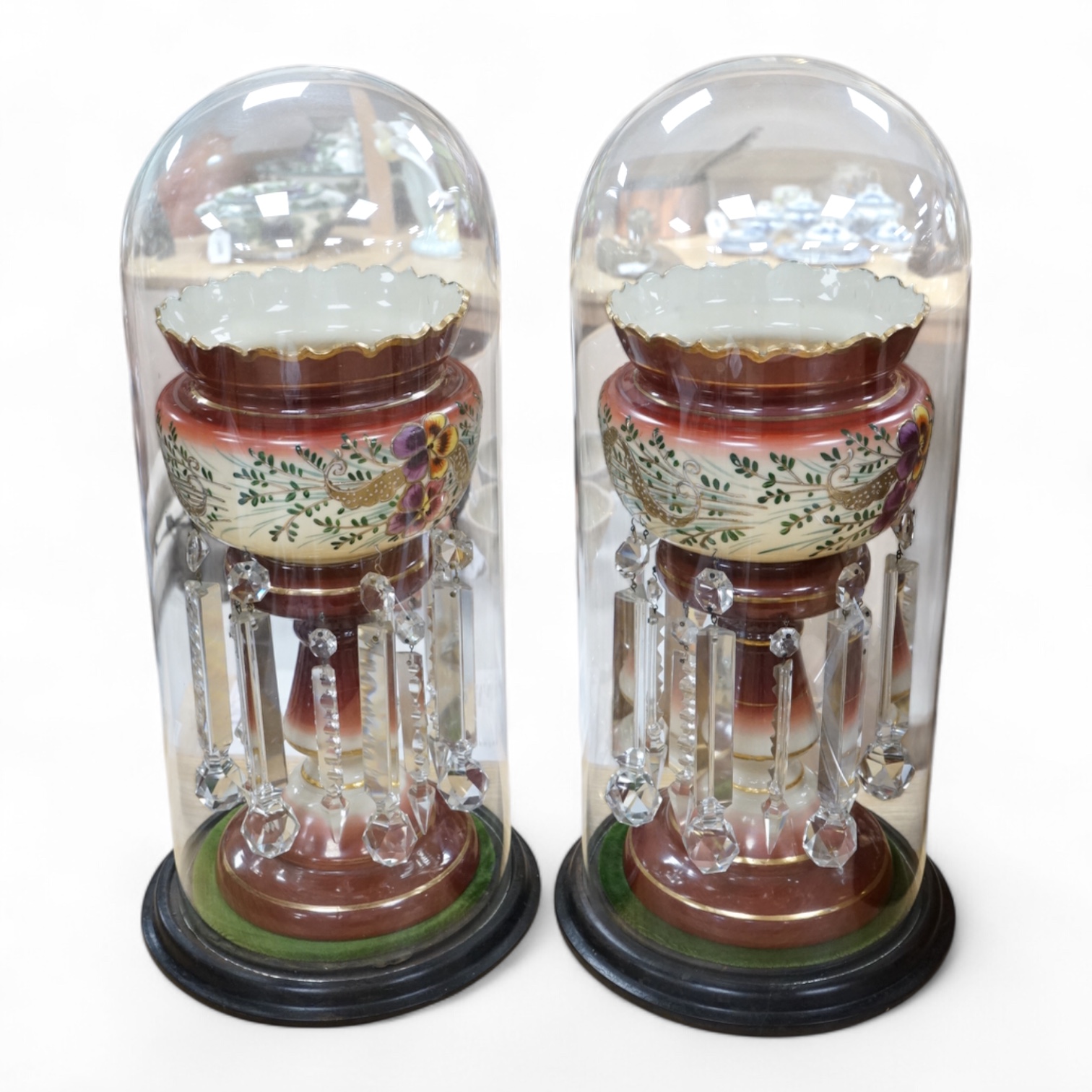A pair of Victorian decorative glass lustres, under glass domes. Tallest dome 53cm high. Condition - good